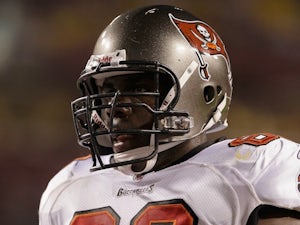 Demar Dotson of the Tampa Bay Buccaneers walks to the line of scrimmage during the first half of a preseason game against the Washington Redskins on September 1, 2011