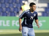 Dom Dwyer #14 of Sporting Kansas City handles the ball during warm up before a game against FC Dallas at Livestrong Sporting Park on March 25, 2012