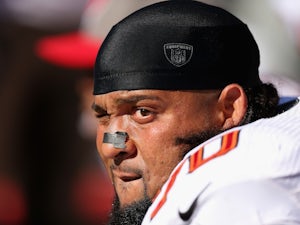 Donald Penn of the Tampa Bay Buccaneers sits on the sidelines during their game against the Oakland Raiders at O.co Coliseum on November 4, 2012