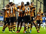 Hull City's players celebrate with Ivorian striker Yannick Sagbo (3rd R) after scoring his team's first goal during the English Premier League football match between Everton and Hull City at Goodison Park in Liverpool, northwest England, on October 19, 20