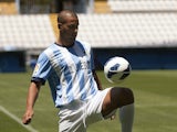 Malaga's new player Argentinian midfielder Fernando Damian Tissone does keepie-up during his official presentation at the Rosaleda stadium in Malaga on July 6, 2013
