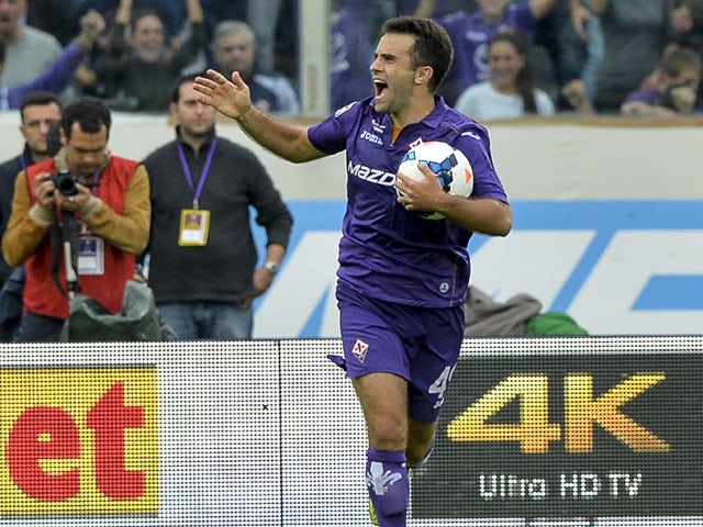 Fiorentina's midfielder Giuseppe Rossi celebrates after scoring during the Italian Serie A football match Fiorentina vs Juventus on October 20, 2013