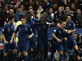 France's players celebrate after midfielder Franck Ribery scored a goal during the 2014 FIFA World Cup qualifying group I football match between France and Finland on October 15, 2013