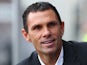 New Sunderland boss Gus Poyet looks on from the dugout during the Barclays Premier League match between Swansea City and Sunderland at the Liberty Stadium on October 19, 2013