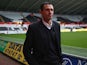 Gus Poyet the manager of Sunderland walks towards the dressing room area ahead of the Barclays Premier League match between Swansea City and Sunderland at the Liberty Stadium on October 19, 2013