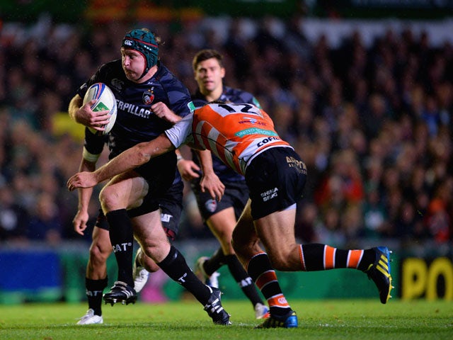 Thomas Waldrom of Tigers in action with Alberto Sgarbi of Treviso during the Heineken Cup match between Leicester Tigers and Benetton Treviso at Welford Road on October 18, 2013