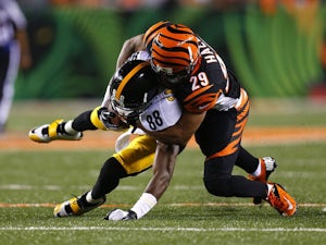 Leon Hall #29 of the Cincinnati Bengals tackles Emmanuel Sanders #88 of the Pittsburgh Steelers during the fourth quarter on September 16, 2013