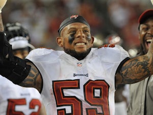 Linebacker Mason Foster of the Tampa Bay Buccaneers celebrates after running an interception back for a touchdown in the 4th quarter against the New Orleans Saints on September 15, 2013