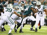 Matthew Tucker #39 of the Philadelphia Eagles is tackled by Danny Lansanah #47 of the New York Jets during their pre season game at MetLife Stadium on August 29, 2013
