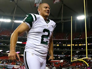 Nick Folk of the New York Jets runs off the field after kicking the game-winning field goal in their 30-28 win over the Atlanta Falcons at Georgia Dome on October 7, 2013