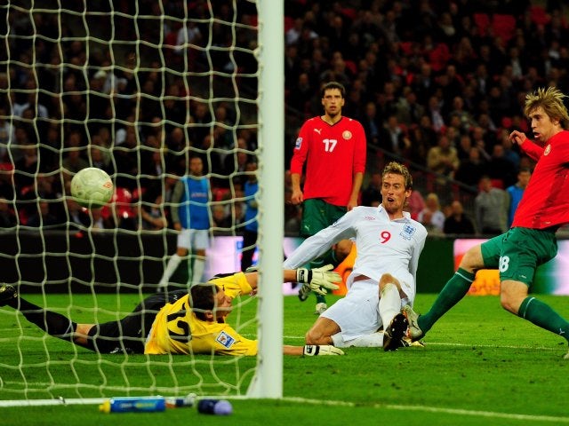 Peter Crouch scores for England against Belarus in October 2009.