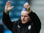 Peter Taylor, manager of Gillingham waves to the fans as he walks onto the pitch before the Sky Bet League One match between Gillingham and Preston North End on October 19, 2013