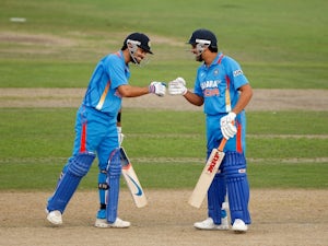 Record-breaking Sharma helps India win