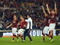 AS Roma's players celebrate at the end of the Serie A football match AS Roma vs Napoli on October 18, 2013