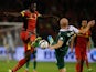 Romelu Lukaku of Belgium and James Collins of Wales stretch for the ball during the FIFA 2014 World Cup Qualifying Group A match on October 15, 2013