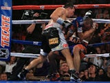 Ruslan Provodnikov (L) of Russia knocks down Mike Alvarado (R) on the ropes in the eighth round at the 1stBank Center on October 19, 2013
