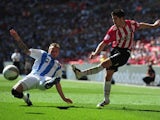 Ryan Flynn of Huddersfield Town battles with Matt Lowton of Sheffield United during the npower League One, playoff final between Huddersfield Town and Sheffield United at Wembley Stadium on May 26, 2012