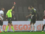 Inter Milan's Slovenian goalkeeper Samir Handanovic gets a red card from referee Daniele Doveri during the Serie A football match Torino vs Inter Milan on October 20, 2013
