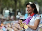 British Paralympic gold medal winning cyclist Sarah Storey waves to the crowd during the London 2012 Victory Parade on September 10, 2012