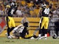 Sean Spence #51 of the Pittsburgh Steelers is tended to by medical staff after being injured against the Carolina Panthers during the preseason game on August 30, 2012