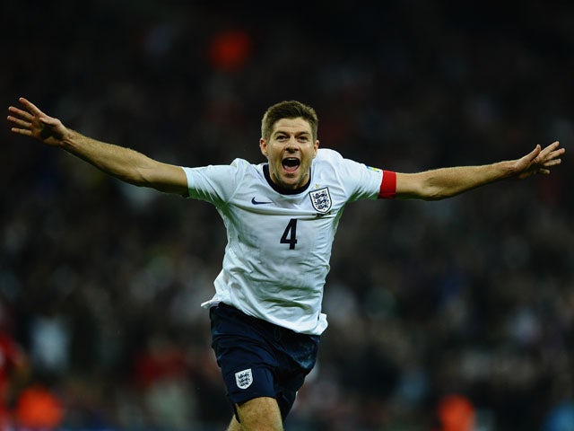 Steven Gerrard of England celebrates scoring the second goal during the FIFA 2014 World Cup Qualifying Group H match between England and Poland at Wembley Stadium on October 15, 2013
