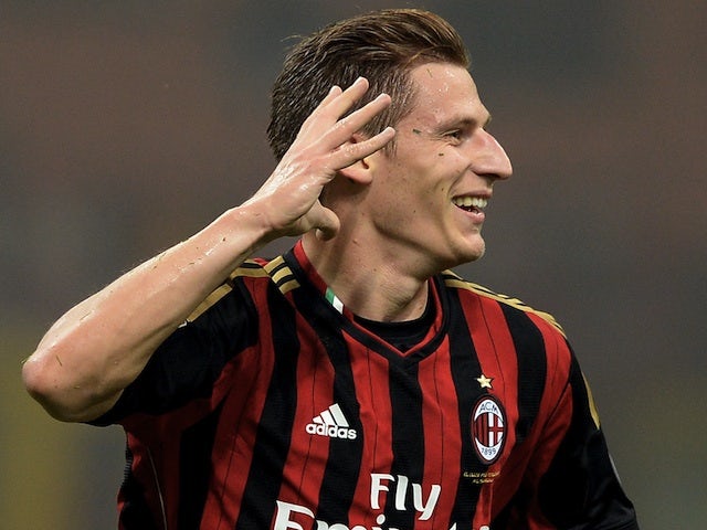Valter Birsa of AC Milan celebrates scoring the first goal during the Serie A match between AC Milan and Udinese Calcio at Giuseppe Meazza Stadium on October 19, 2013