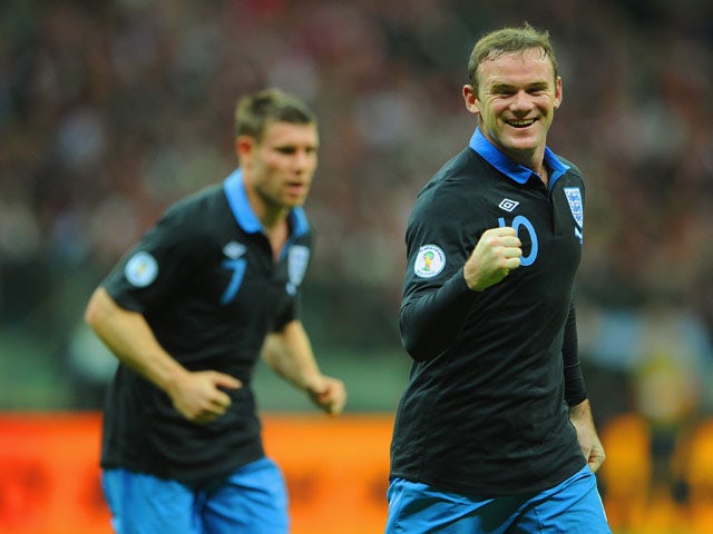 Wayne Rooney of England celebrates scoring to make it 1-0 during the FIFA 2014 World Cup Qualifier between Poland and England at the National Stadium on October 17, 2012