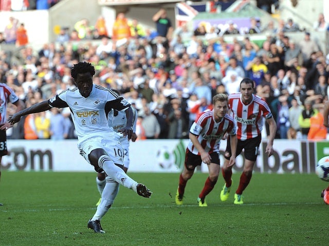 Wilfried Bony of Swansea City scores a penalty during the Barclays Premier League match between Swansea City and Sunderland at Liberty Stadium on October 19, 2013