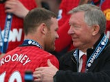 Alex Ferguson congratulates Wayne Rooney upon winning the Premier League title in May 2013.