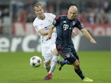 Vitoria Plzen's David Limbersky and Bayern Munich's Arjen Robben vie for the ball during the UEFA Champions League group D match on October 23, 2013