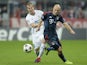 Vitoria Plzen's David Limbersky and Bayern Munich's Arjen Robben vie for the ball during the UEFA Champions League group D match on October 23, 2013
