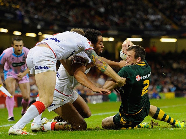 Australia's Brett Morris beat England's defence to scores a try during their World Cup Group A match on October 26, 2013