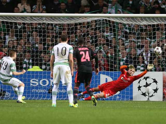 Ajax's goalkeeper Kenneth Vermeer is beaten by the penalty kick taken by Celtic's Scottish midfielder James Forrest during the UEFA Champions League Group H football match between Celtic and Ajax at Celtic Park in Glasgow, Scotland, on October 22, 2013