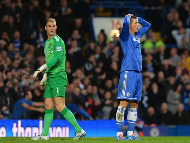 Joe Hart of Manchester City looks on as Fernando Torres of Chelsea reacts after missing a chance at goal during the Barclays Premier League match between Chelsea and Manchester City at Stamford Bridge on October 27, 2013