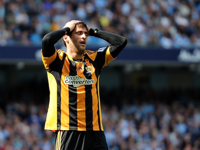 Hull City striker Danny Graham holds his head in his hands during the Premier League match at Manchester City on August 31, 2013