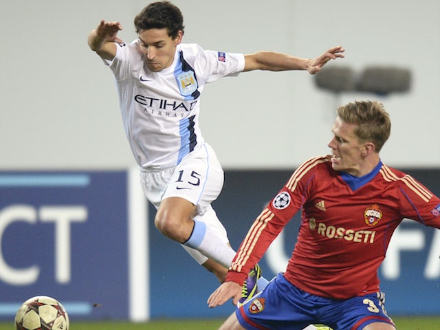 CSKA Mocow's midfielder Pontus Wernbloom vies with Manchester City's midfielder Jesus Navas during their UEFA Champions League group D football match in Moscow on October 23, 2013