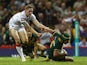 Australia's Jonathan Thurston scores his team's opening try against England during their World Cup Group A match on October 26, 2013