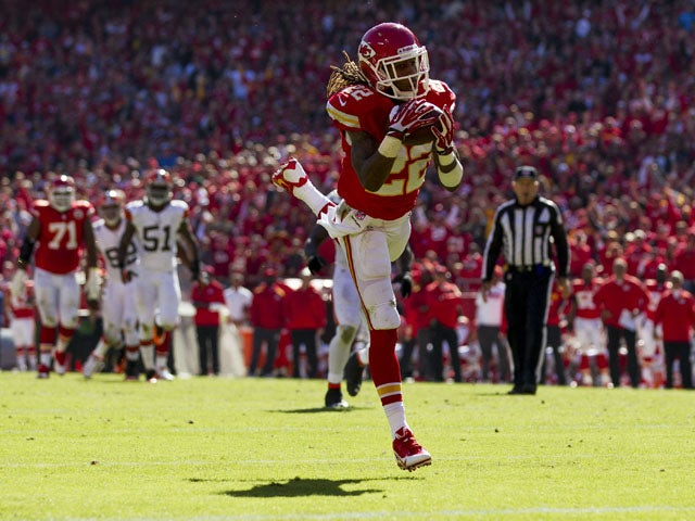 Running back Jamaal Charles #25 of the Kansas City Chiefs makes a leaping catch into the end zone for a touchdown during the game against the Cleveland Browns at Arrowhead Stadium on October 27, 2013