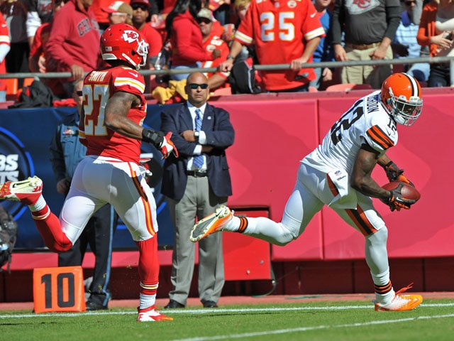 Wide receiver Josh Gordon #12 of the Cleveland Browns catches a 39-yard touchdown against defensive back Sean Smith #27 of the Kansas City Chiefs during the first half on October 27, 2013
