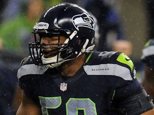 Outside linebacker K.J. Wright of the Seattle Seahawks celebrates a tackle during the first quarter of the game at CenturyLink Field on December 23, 2012