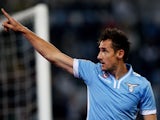 Miroslav Klose of SS Lazio celebrates after scoring the opening goal during the Serie A match between SS Lazio and Cagliari Calcio at Stadio Olimpico on October 27, 2013