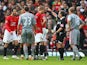 Referee Alan Wiley shows a red card to Nemanja Vidic of Manchester United during the Barclays Premier League match between Manchester United and Liverpool at Old Trafford on March 14, 2009