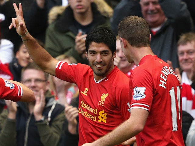 Luis Suarez of Liverpool celebrates completing his hat-trick during the Barclays Premier League match against West Brom on October 26, 2013