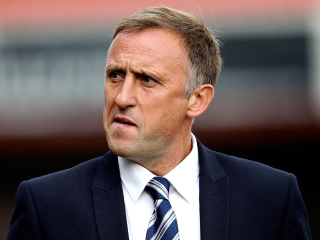 Cheltenham manager Mark Yates looks on prior to the Sky Bet League Two match between Cheltenham Town and AFC Wimbledon at The Abbey Business Stadium on September 28, 2013