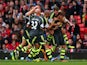 Marko Arnautovic of Stoke City is mobbed by team mates after scoring from a free kick during the Barclays Premier League match against Manchester United on October 26, 2013