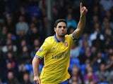 Arsenal's Mikel Arteta celebrates after scoring the opening goal via the penalty spot against Crystal Palace on October 26, 2013
