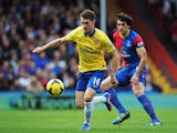Arsenal's Aaron Ramsey and Crystal Palace's Mile Jedinak in action during their Premier League match on October 26, 2013