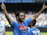 SSC Napoli's forward Gonzalo Higuain celebrates after scoring during the Italian Serie A football match SSC Napoli vs Torino FC in San Paolo Stadium on October 27, 2013