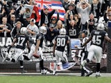 Terrelle Pryor #2 of the Oakland Raiders is congratulated by teammates and fans after he ran 93-yards for a touchdown on the first play of their game against the Pittsburgh Steelers at O.co Coliseum on October 27, 2013