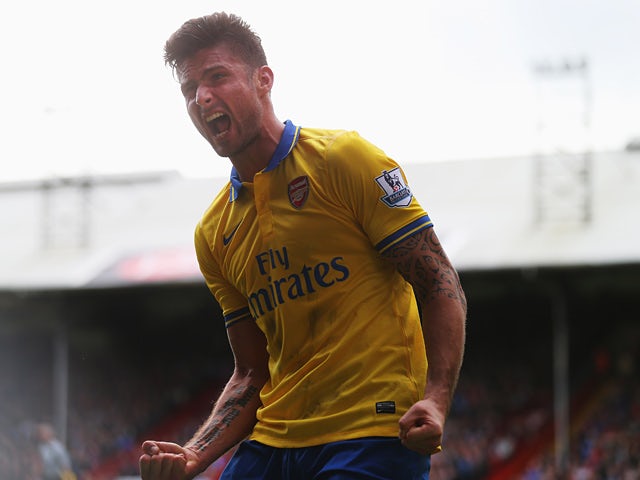 Arsenal's Olivier Giroud celebrates after scoring his team's second goal against Crystal Palace on October 26, 2013